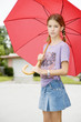 A young girl with an umbrella