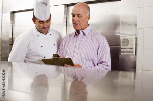 Commercial Kitchen Cart on Photo  Male Chef And Restaurant Manager Talking In Commercial Kitchen