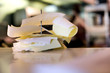 Photo: Stack of order checks on paper spindle in restaurant, close-up (differential focus, surface level) Stack of order checks on paper spindle in restaurant, close-up (differential focus, surface level)