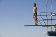 A diver standing on a diving board
