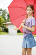 A young girl with an umbrella