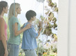 A mother and her children looking at their garden