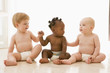 Three babies holding hands