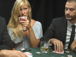 Woman holding playing cards in poker game