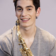 A teenage boy with a saxophone