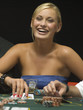 Happy woman at poker game