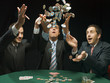 Men throwing poker chips in air
