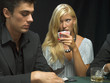 Woman holding playing cards in poker game
