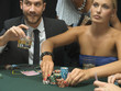 Couple with poker chips at poker game