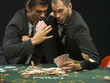 Men fighting at poker game