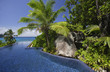 Photo: Swimming pool and palm trees of the Banyan Tree Hotel, Anse Intendance, Mahe', Seychelles Swimming pool and palm trees of the Banyan Tree Hotel, Anse Intendance, Mahe', Seychelles