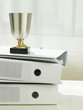 Trophy on stack of folders