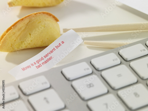 Photo: Chinese fortune cookie on desk Chinese fortune cookie on desk