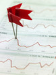 View of red flags marking peak of graph