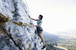 A climber climbing a rock face
