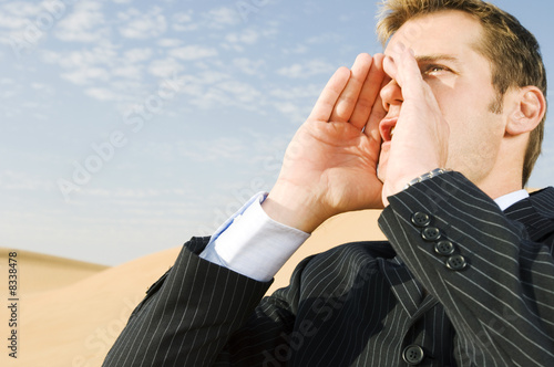 Photo: A man in a suit shouting for attention A man in a suit shouting for attention