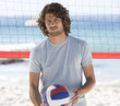 A man playing beach volleyball