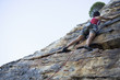 A climber climbing a rock face