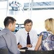 A young couple buying a new car