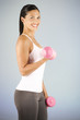 A young woman lifting weights