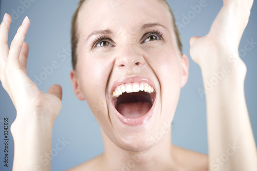 Photo: A young woman laughing A young woman laughing
