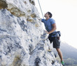 A climber climbing a rock face