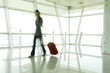 A woman walking through an airport