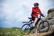 Foto: girl cycling in the mountains girl cycling in the mountains
