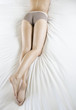 A woman laying on a bed