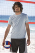 A man playing beach volleyball