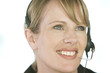 A young woman wearing an audio headset