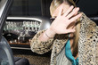 A woman in a stretch limousine