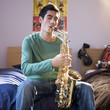 A teenage boy with a saxophone