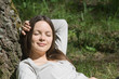 The girl laying near a tree The girl laying near a tree