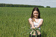 The girl in field with ears in hands The girl in field with ears in hands