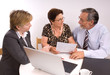 Mature couple talking to financial planner Mature couple talking to financial planner