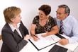 Mature couple talking to financial planner