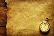 Pocket clock on old paper