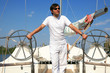 Young man on sailboat desk looks ahead. Young man on sailboat desk looks ahead.