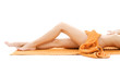 long legs of relaxed lady with orange towel