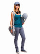 Portrait of a girl standing with skateboard and bag