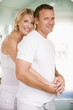 Couple in bathroom embracing and smiling Couple in bathroom embracing and smiling