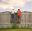 Two boys on the fence looking for smth Two boys on the fence looking for smth