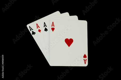 Photo: Casino Poker Playing Cards - Four Aces, isolated on black Casino Poker Playing Cards - Four Aces, isolated on black