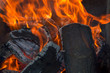 burning flame on the charcoal and wood burning flame on the charcoal and wood