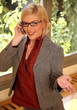  Young businesswoman sitting at office window