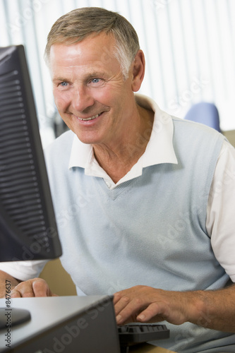 Photo: Senior man working on a computer Senior man working on a computer