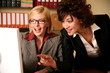  Two women working at the computer
