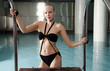 Young woman in a swimming pool at a spa