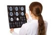 Photo en ligne au meilleur prix Female doctor examining a brain cat scan.